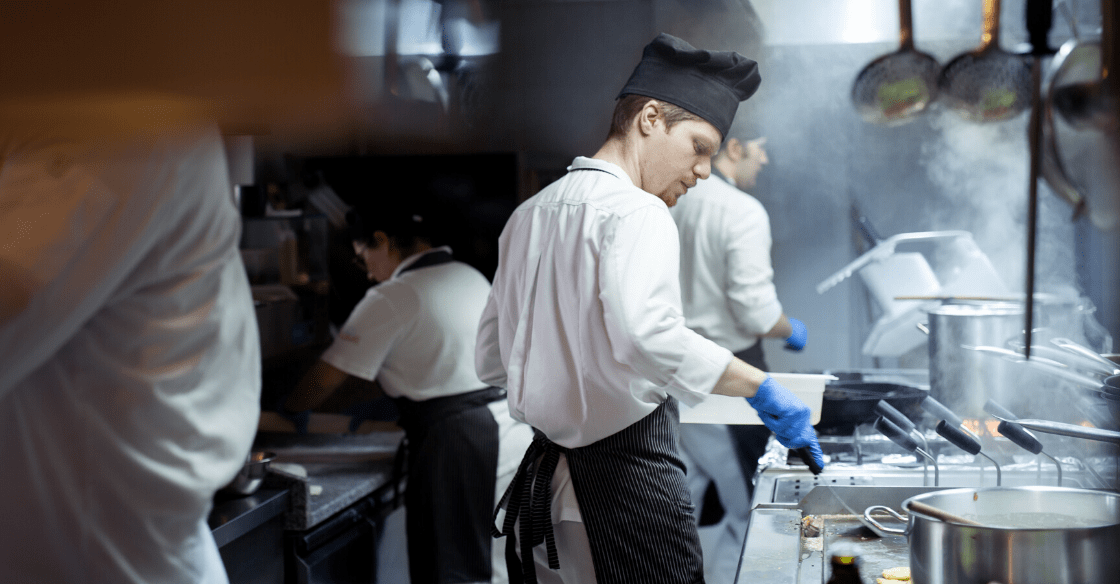 Chef cooking in industrial kitchen