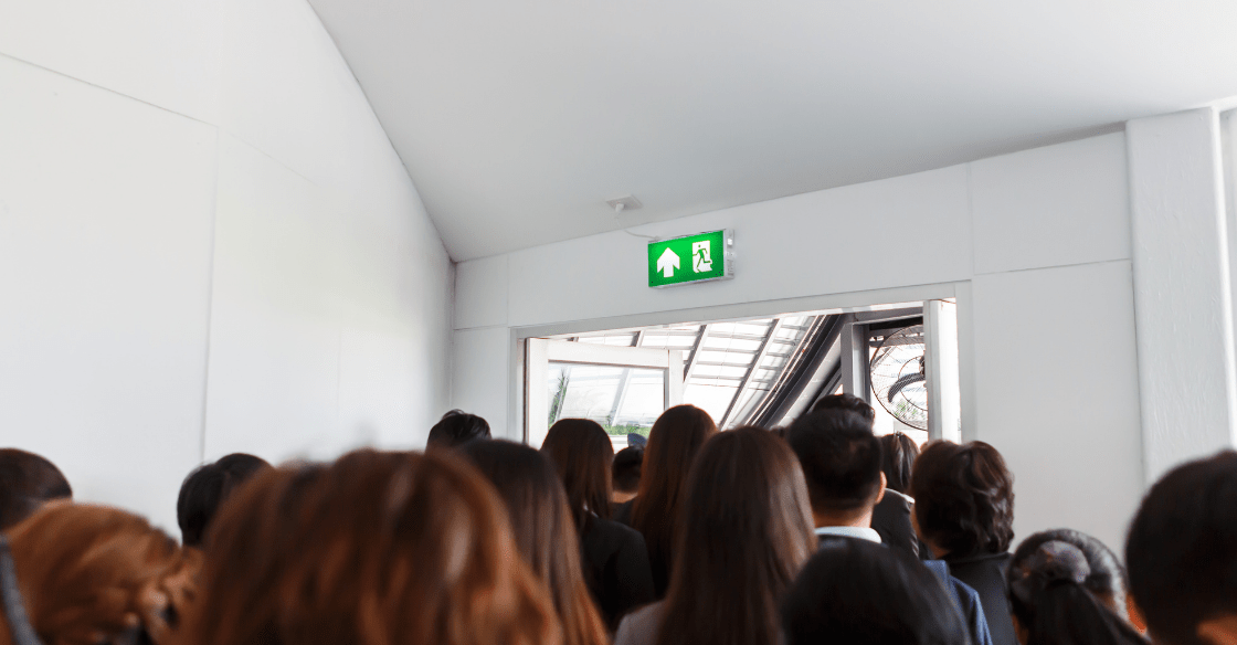 People following exit signs during an emergency 